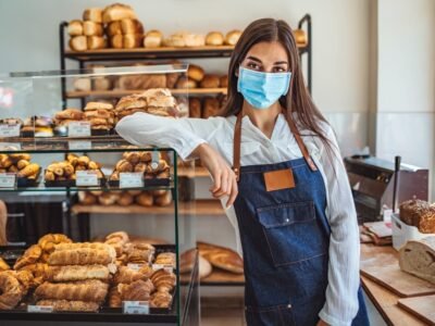 Woman,Working,At,A,Bakery,Wearing,A,Facemask,To,Avoid